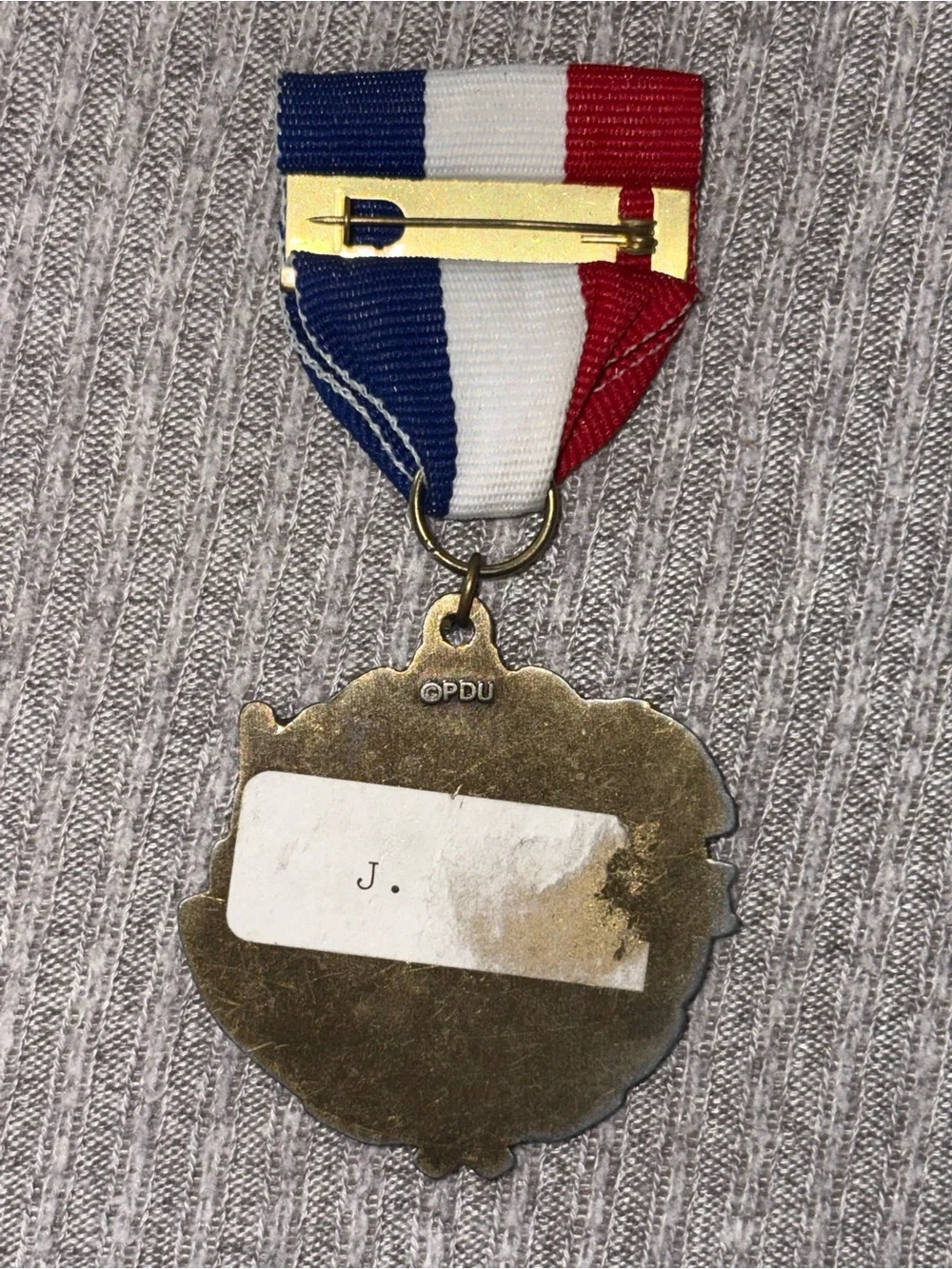 PDU marked bronze tone round football & helmet medal brooch w multicolor ribbon